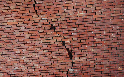 cracked red brick wall