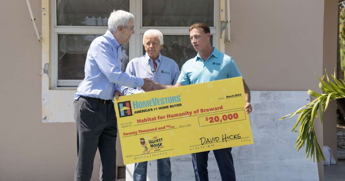 HomeVestors writes check to Habitat for Humanity